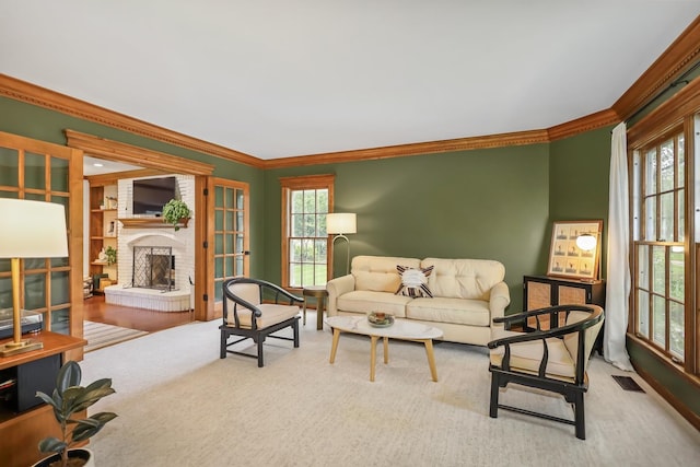 1091 Danforth Dr, Batavia, IL 60510 - carpeted living room featuring crown molding, a brick fireplace, and plenty of natural light