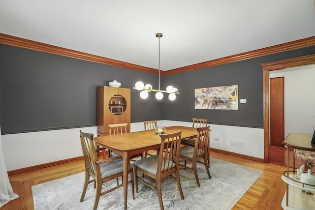 1091 Danforth Dr, Batavia, IL 60510 - dining area featuring light wood-type flooring and ornamental molding