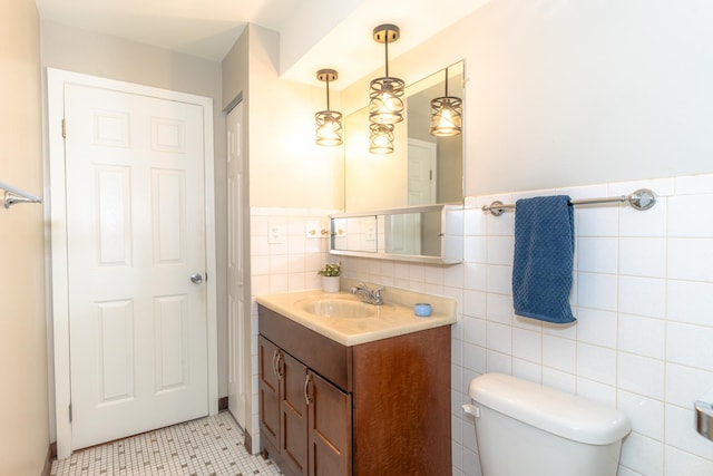 2537 Thatcher Ave Unit 3E, River Grove, IL 60171 - bathroom featuring vanity, tile walls, wainscoting, and tile patterned floors
