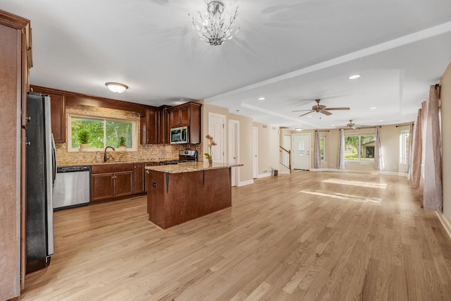 6120 W 98th St, Oak Lawn, IL 60453 - kitchen with appliances with stainless steel finishes, open floor plan, decorative backsplash, light wood-type flooring, and recessed lighting
