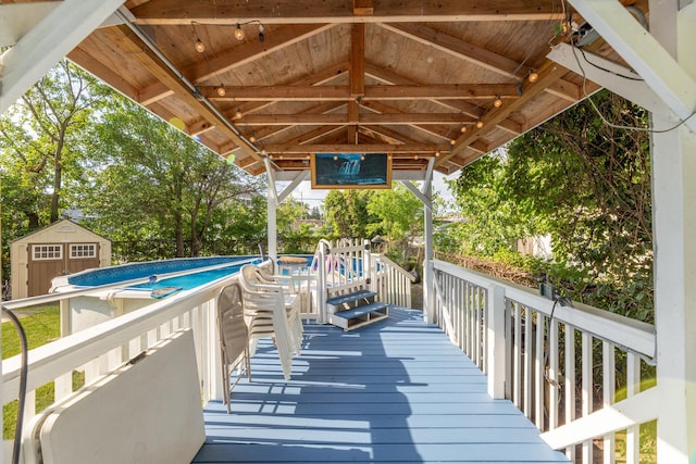 6120 W 98th St, Oak Lawn, IL 60453 - deck featuring a shed, a gazebo, and an outdoor pool