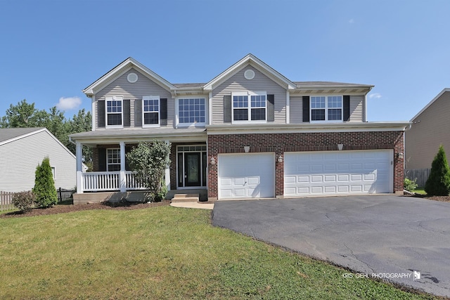 1305 Lilac Ln, Harvard, IL 60033 - traditional-style home featuring covered porch, driveway, a front yard, a garage, and brick siding
