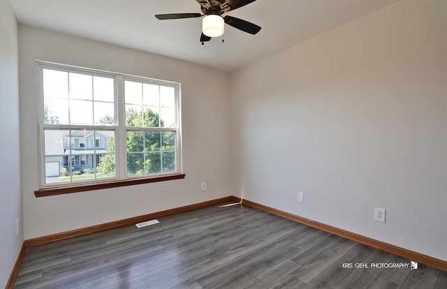 1305 Lilac Ln, Harvard, IL 60033 - empty room with plenty of natural light, wood finished floors, and ceiling fan