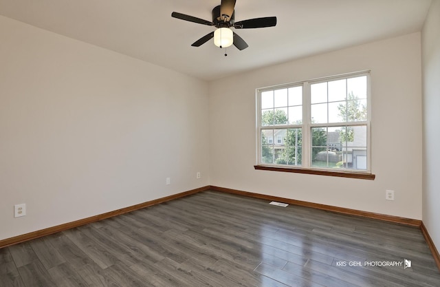 1305 Lilac Ln, Harvard, IL 60033 - spare room featuring dark wood finished floors and a ceiling fan