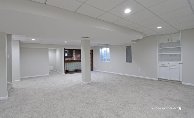 1305 Lilac Ln, Harvard, IL 60033 - below grade area with electric panel, light carpet, a drop ceiling, and recessed lighting