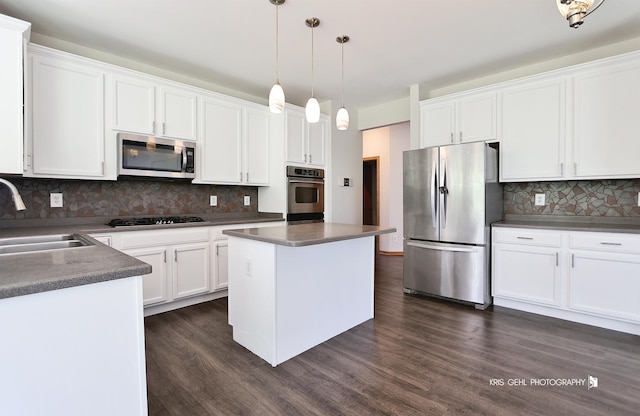 1305 Lilac Ln, Harvard, IL 60033 - kitchen featuring stainless steel appliances, decorative backsplash, white cabinets, and dark wood-style floors