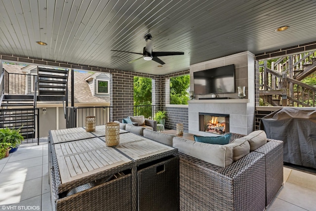 823 W George St Unit 1, Chicago, IL 60657 - view of patio featuring stairway, an outdoor living space with a fireplace, ceiling fan, and grilling area