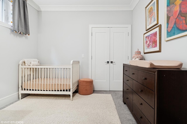 823 W George St Unit 1, Chicago, IL 60657 - bedroom featuring a closet, a crib, and light carpet