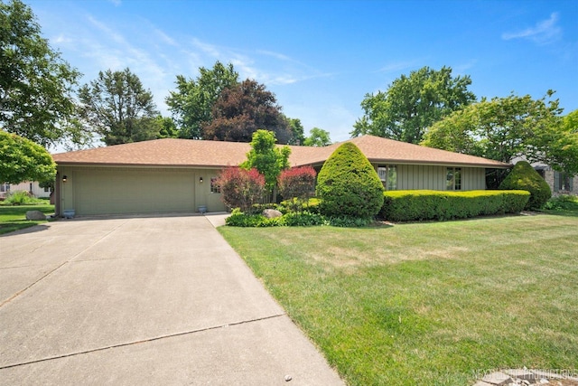 2050 Alschuler Dr, Aurora, IL 60506 - ranch-style house with a garage, driveway, a front yard, and board and batten siding