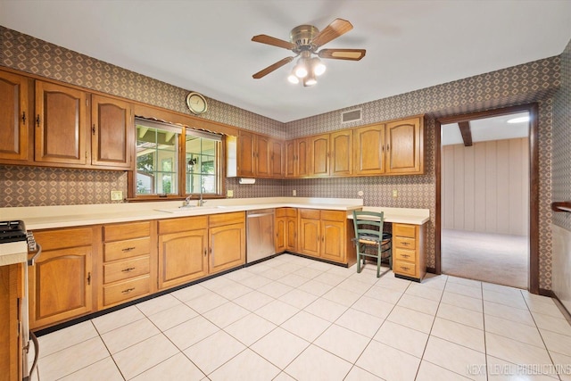2050 Alschuler Dr, Aurora, IL 60506 - kitchen with appliances with stainless steel finishes, wallpapered walls, light countertops, and brown cabinets