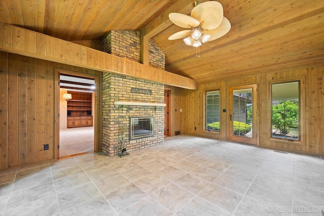 2050 Alschuler Dr, Aurora, IL 60506 - unfurnished living room with wood walls, wood ceiling, a ceiling fan, a brick fireplace, and tile patterned flooring