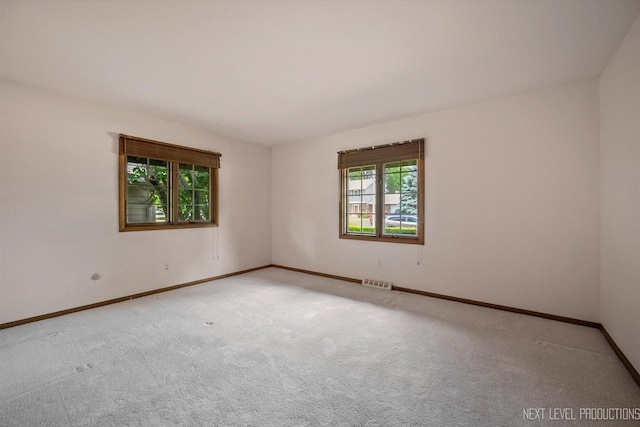 2050 Alschuler Dr, Aurora, IL 60506 - spare room featuring carpet flooring and baseboards