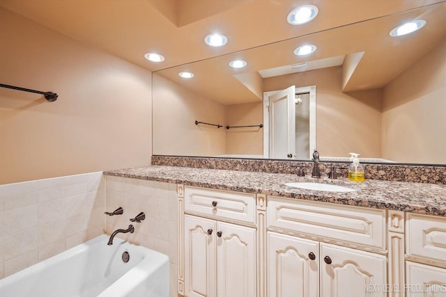 2050 Alschuler Dr, Aurora, IL 60506 - bathroom with vanity, a bath, and recessed lighting