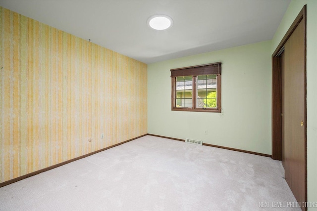 2050 Alschuler Dr, Aurora, IL 60506 - unfurnished bedroom with carpet and wallpapered walls