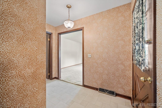 2050 Alschuler Dr, Aurora, IL 60506 - hallway with wallpapered walls and baseboards