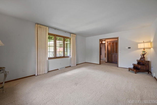 2050 Alschuler Dr, Aurora, IL 60506 - spare room featuring carpet flooring and baseboards