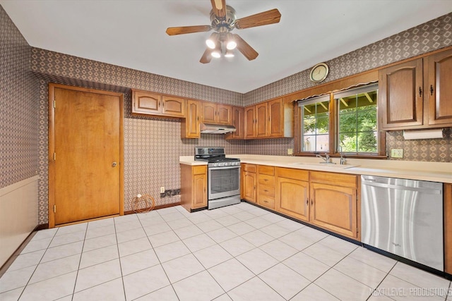 2050 Alschuler Dr, Aurora, IL 60506 - kitchen featuring stainless steel appliances, wallpapered walls, under cabinet range hood, light countertops, and a ceiling fan