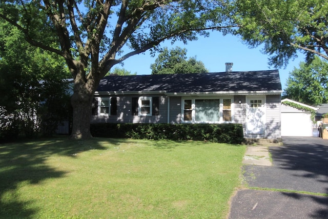 1521 Adams St, Lake In The Hills, IL 60156 - view of front of property with a front yard, a chimney, and asphalt driveway
