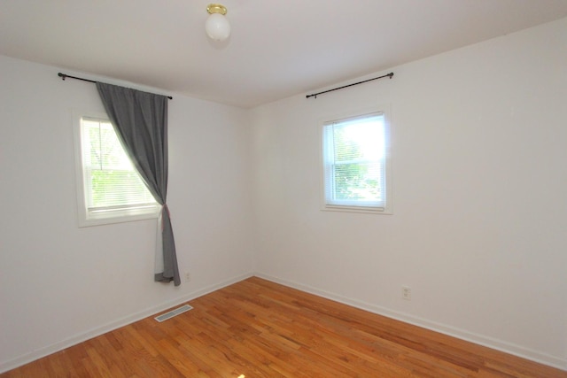 1521 Adams St, Lake In The Hills, IL 60156 - empty room with plenty of natural light and light wood-style floors