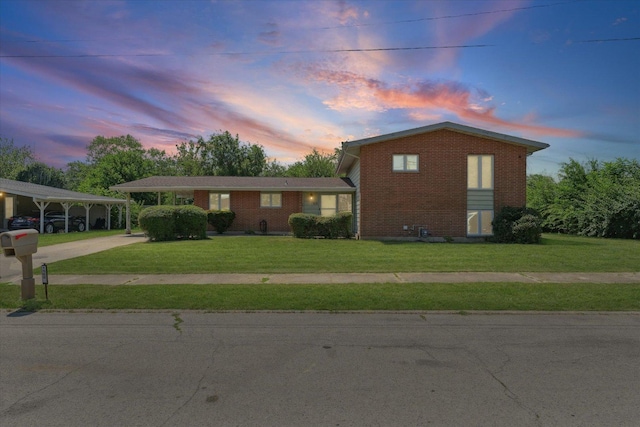 1565 S Pointe Dr, Rantoul, IL 61866 - tri-level home featuring brick siding, driveway, and a front lawn