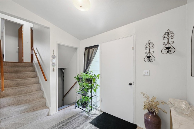1565 S Pointe Dr, Rantoul, IL 61866 - foyer featuring vaulted ceiling, stairway, and light carpet