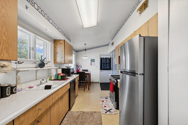 1565 S Pointe Dr, Rantoul, IL 61866 - kitchen with freestanding refrigerator, dishwasher, black microwave, light countertops, and gas range
