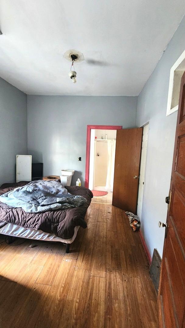 5234 W 25th Pl, Cicero, IL 60804 - bedroom with wood finished floors and ensuite bathroom