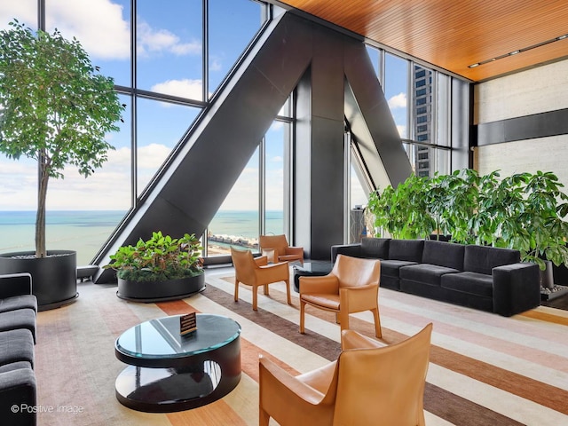 175 E Delaware Pl Unit 8808, Chicago, IL 60611 - community lobby with a wall of windows, a water view, and a towering ceiling
