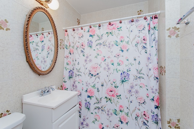 3628 N Oconto Ave, Chicago, IL 60634 - bathroom with vanity, a shower with shower curtain, and tile walls