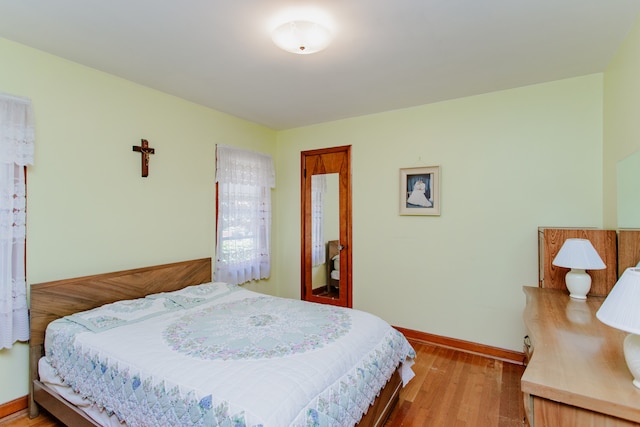 3628 N Oconto Ave, Chicago, IL 60634 - bedroom featuring light wood-style floors and baseboards