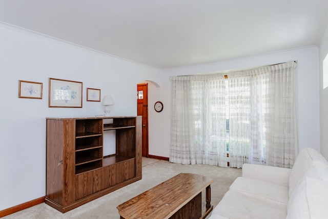 3628 N Oconto Ave, Chicago, IL 60634 - living area with arched walkways, light carpet, and crown molding
