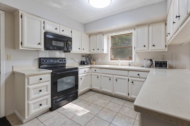 11280 James Ct, Genoa, IL 60135 - kitchen featuring black appliances, a textured ceiling, light countertops, light tile patterned floors, and white cabinets