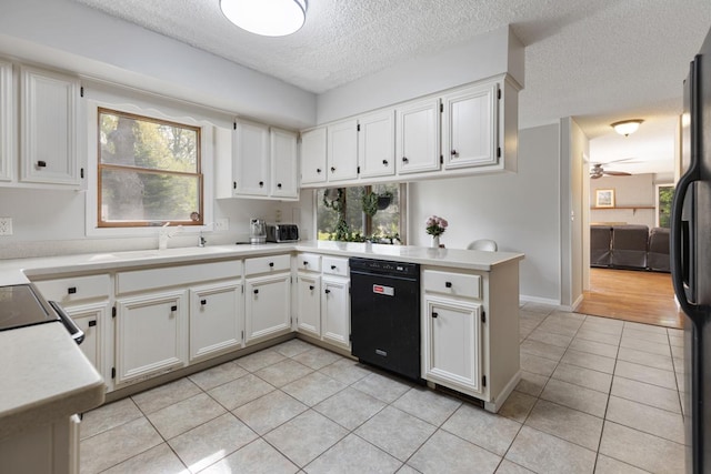 11280 James Ct, Genoa, IL 60135 - kitchen featuring black appliances, light tile patterned flooring, a textured ceiling, healthy amount of natural light, and ceiling fan