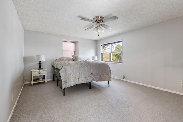 11280 James Ct, Genoa, IL 60135 - carpeted bedroom featuring a textured ceiling and a ceiling fan