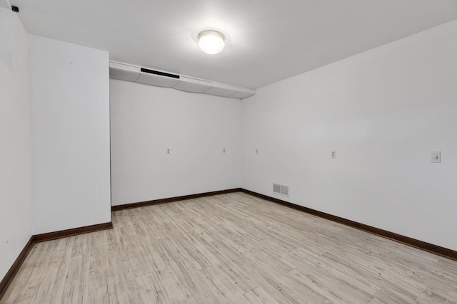 11280 James Ct, Genoa, IL 60135 - spare room featuring baseboards and light wood-type flooring