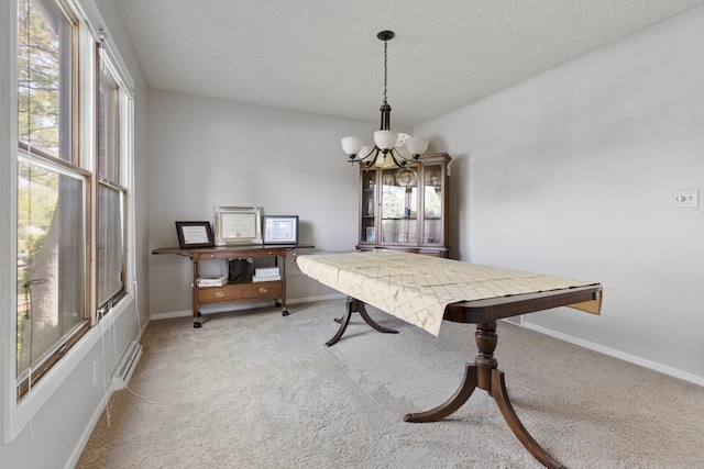 11280 James Ct, Genoa, IL 60135 - dining room featuring healthy amount of natural light, a chandelier, light carpet, and a textured ceiling