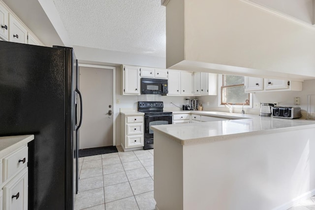 11280 James Ct, Genoa, IL 60135 - kitchen featuring black appliances, a peninsula, light countertops, white cabinetry, and a textured ceiling