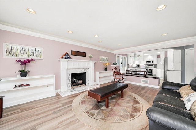 905 W Palm Dr, Mount Prospect, IL 60056 - living room with crown molding, light wood finished floors, recessed lighting, and a fireplace