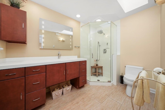 905 W Palm Dr, Mount Prospect, IL 60056 - bathroom featuring a shower stall, vanity, a skylight, and recessed lighting