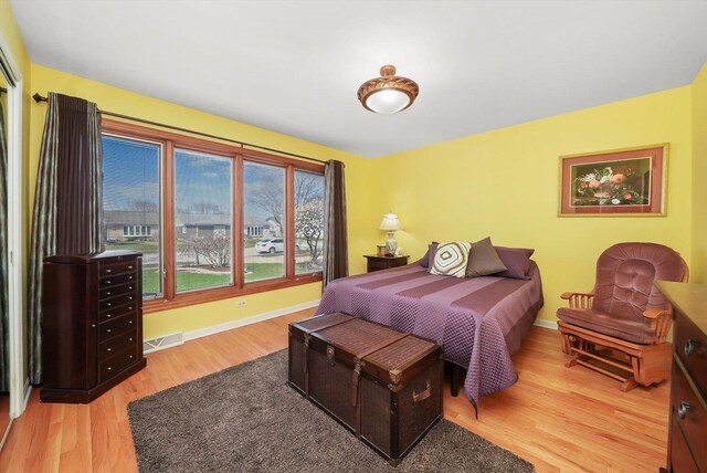 905 W Palm Dr, Mount Prospect, IL 60056 - bedroom with wood finished floors and baseboards