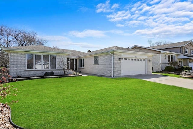 905 W Palm Dr, Mount Prospect, IL 60056 - tri-level home featuring a garage, brick siding, driveway, and a front lawn