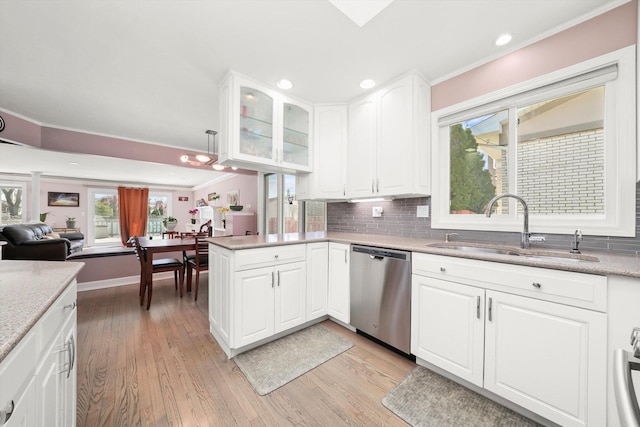 905 W Palm Dr, Mount Prospect, IL 60056 - kitchen with dishwasher, crown molding, light wood finished floors, backsplash, and healthy amount of natural light