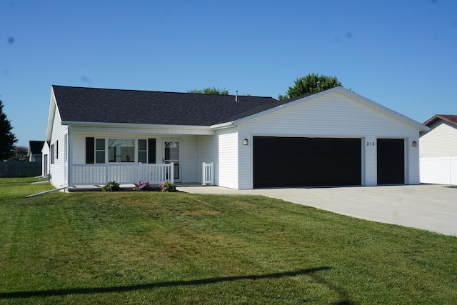 view of front of home with covered porch, a garage, a front lawn, concrete driveway, and a shingled roof