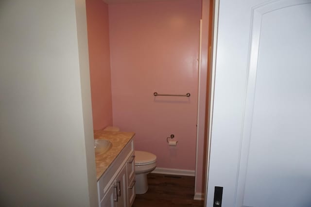bathroom with vanity and wood finished floors