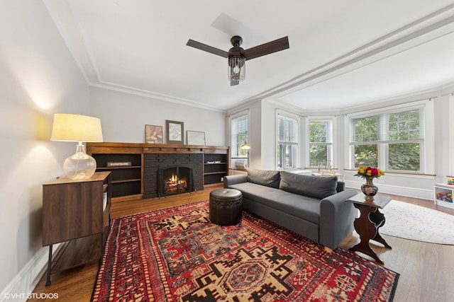 5308 N Glenwood Ave Unit 3N, Chicago, IL 60640 - living area featuring wood finished floors, a brick fireplace, a ceiling fan, and crown molding