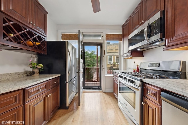 5308 N Glenwood Ave Unit 3N, Chicago, IL 60640 - kitchen with appliances with stainless steel finishes, light wood-style floors, ceiling fan, and light stone countertops