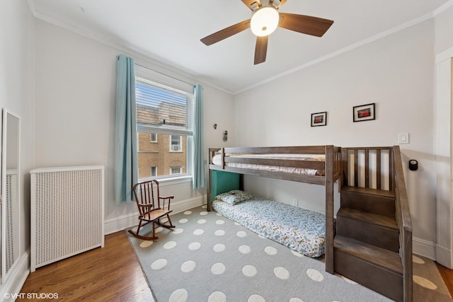 5308 N Glenwood Ave Unit 3N, Chicago, IL 60640 - bedroom featuring radiator heating unit, ornamental molding, wood finished floors, and ceiling fan