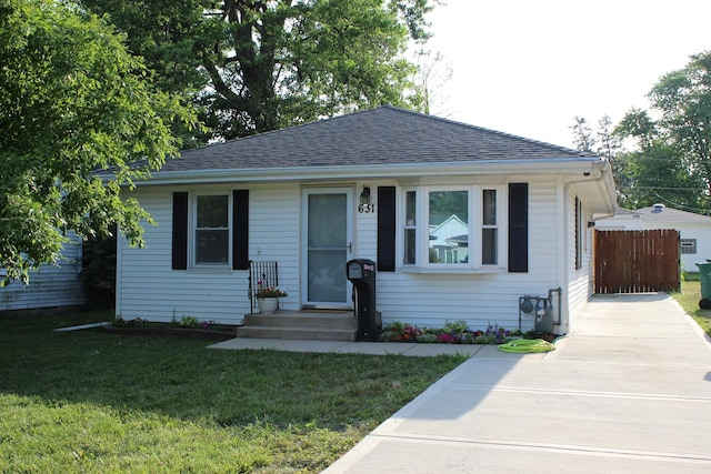 631 Central Ave, Joliet, IL 60436 - view of front of house with concrete driveway and roof with shingles