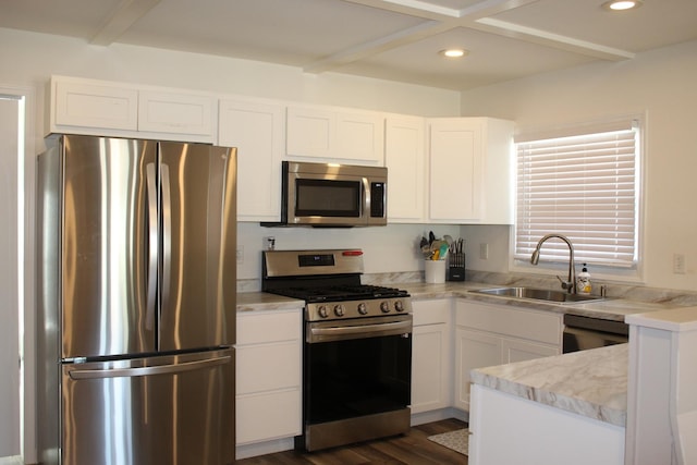 631 Central Ave, Joliet, IL 60436 - kitchen featuring appliances with stainless steel finishes, white cabinetry, light countertops, dark wood-type flooring, and recessed lighting