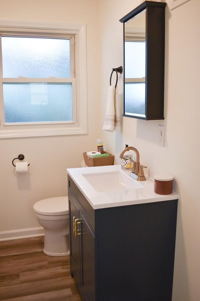 631 Central Ave, Joliet, IL 60436 - half bathroom featuring vanity and wood finished floors